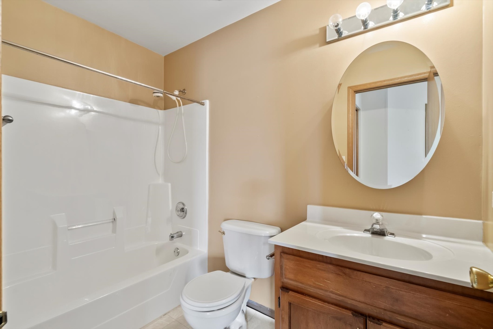 913 Barton Lane Peotone, IL 60468 - Photo 11 of 15 a bathroom with a sink a toilet and a mirror