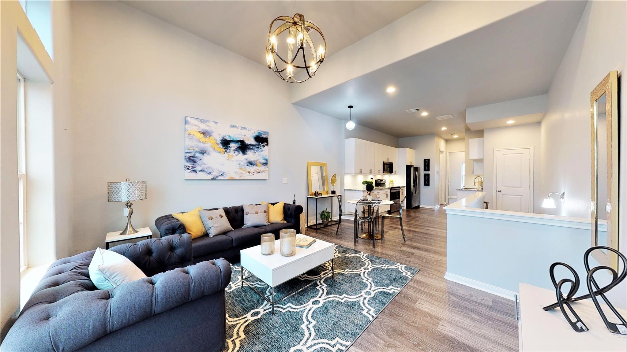 4924 Paradigm Ln Spring Spring, TX 77379 - Photo 2 of 18 Open-concept living area with high ceilings and abundant natural light. The space can be elegantly designed, ideal for comfortable living and entertaining.