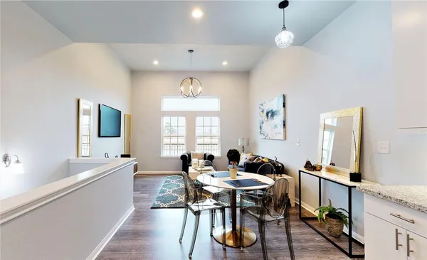 a view of a dining room with furniture window and wooden floor