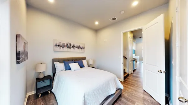 a bedroom with a bed and a view of bathroom