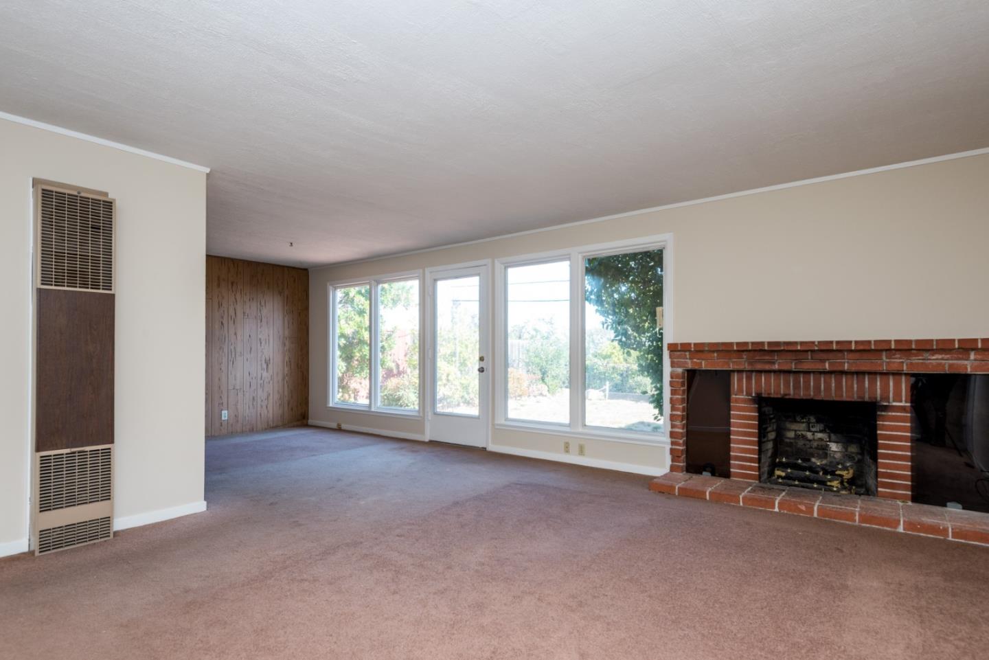 758 Pepper Drive San Bruno, CA 94066 - Photo 2 of 17 a view of empty room with a fireplace