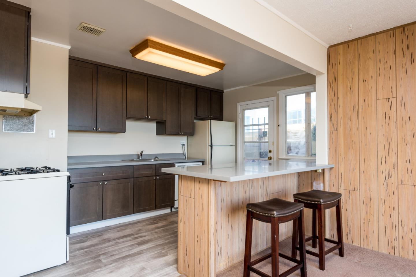 758 Pepper Drive San Bruno, CA 94066 - Photo 6 of 17 a kitchen with stainless steel appliances granite countertop a stove a sink dishwasher and a refrigerator