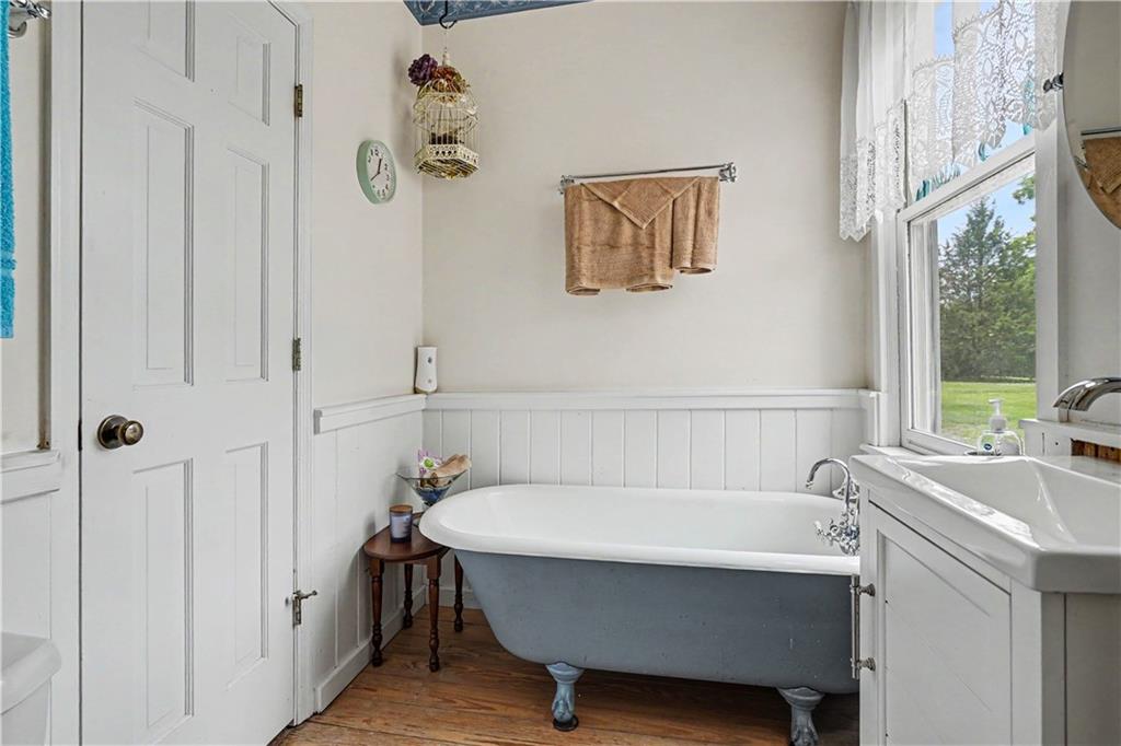 355 Inman Road Hampton, GA 30228 - Photo 30 of 47 a bathroom with a tub and a sink