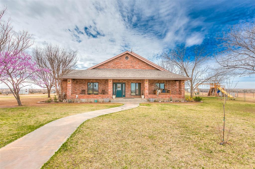 12487 County Road 4102 Hermleigh, TX 79526 - Photo 14 of 40 a front view of a house with swimming pool
