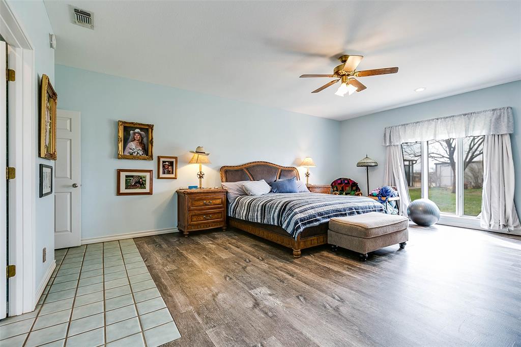 12487 County Road 4102 Hermleigh, TX 79526 - Photo 23 of 40 a bedroom with a bed mirror and window