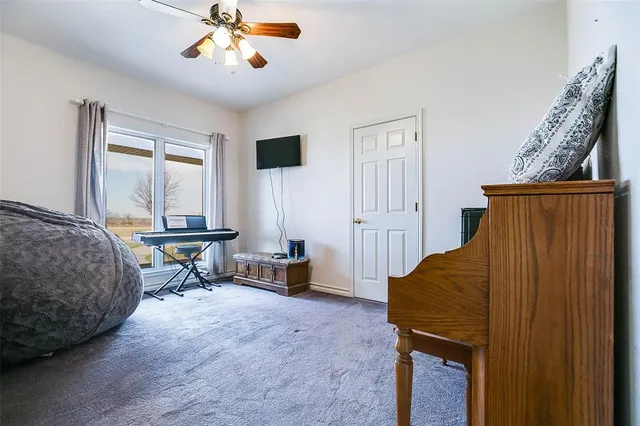 a view of walk in closet and window