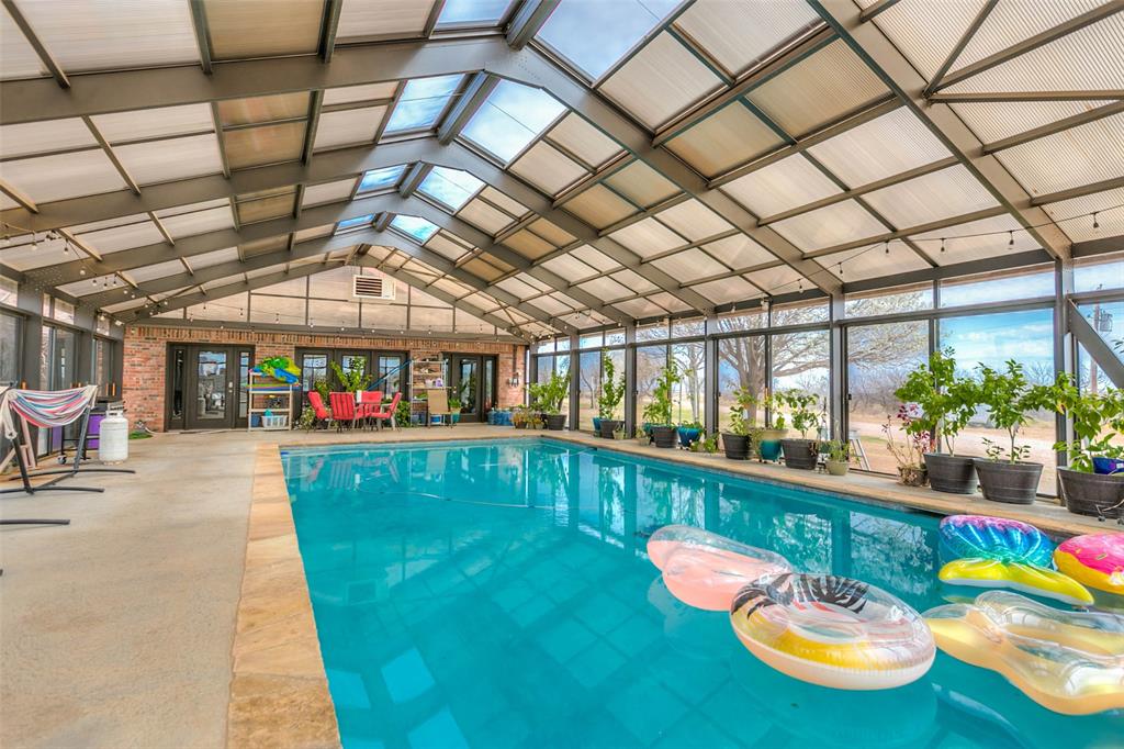 12487 County Road 4102 Hermleigh, TX 79526 - Photo 32 of 40 a dining room with stainless steel appliances kitchen island granite countertop furniture and a kitchen view