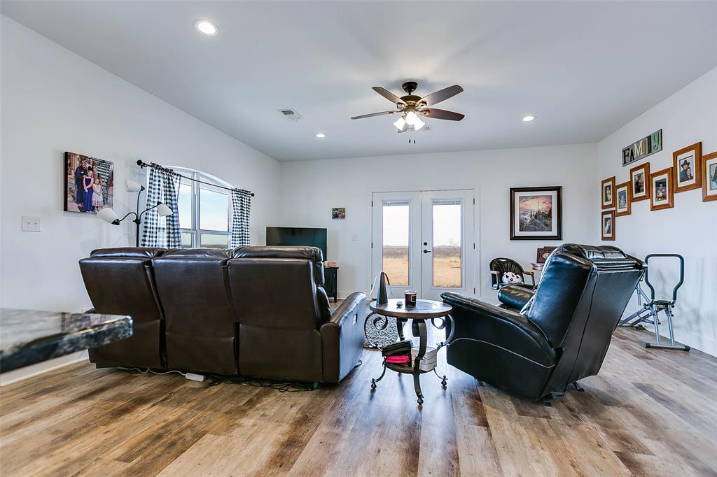12487 County Road 4102 Hermleigh, TX 79526 - Photo 5 of 40 a living room with furniture and a wooden floor