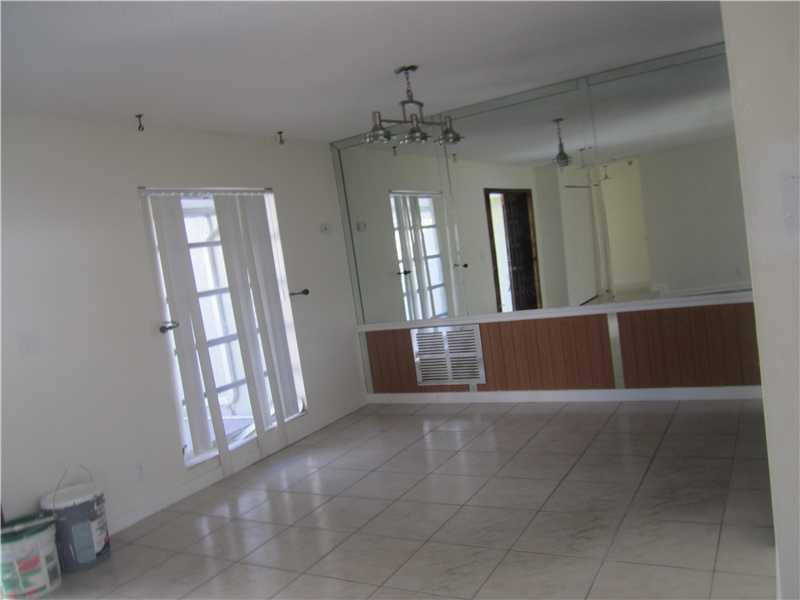6320 Southwest 6th Street Margate, FL 33068 - Photo 2 of 8 a view of a hallway with windows and chandelier