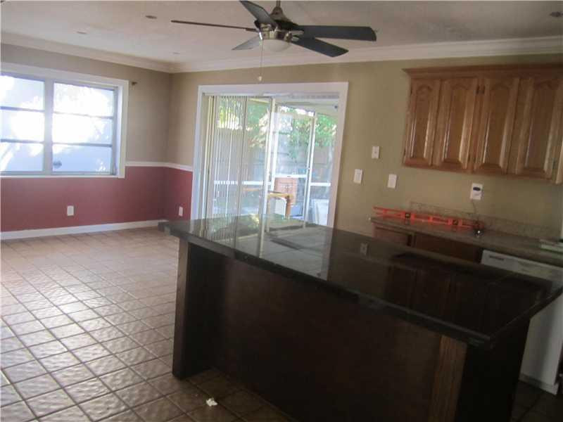 6320 Southwest 6th Street Margate, FL 33068 - Photo 4 of 8 a kitchen with a sink and large window