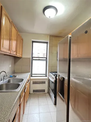 a kitchen that has a sink and a stove