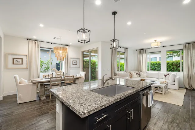 a living room with furniture fireplace and flat screen tv