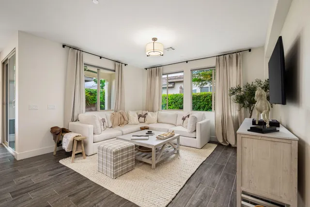 a living room with furniture fireplace and flat screen tv