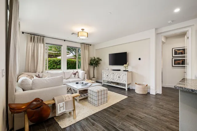a bedroom with a bed and a potted plant