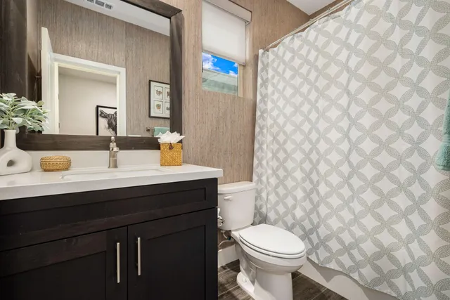 a view of a porch with furniture and a yard