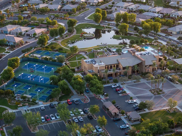 a view of a swimming pool with outdoor seating