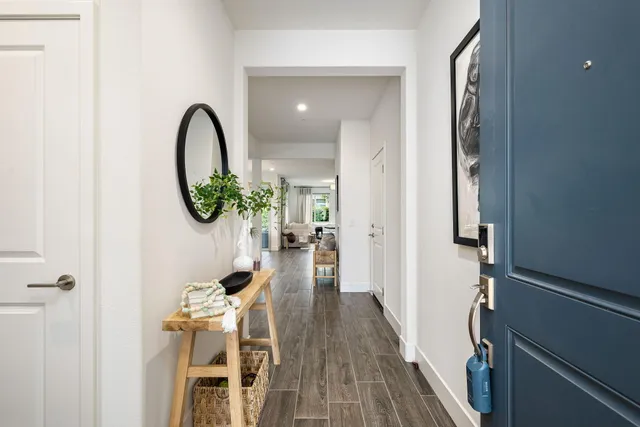 a living room with furniture dining room and wooden floor