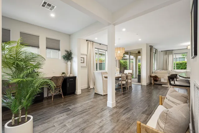 a large kitchen with a table and chairs