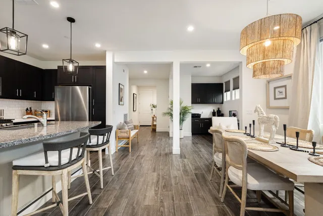 a view of a workspace with furniture and a potted plant