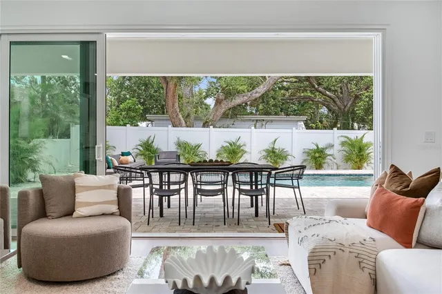 a living room with a couch and a lamp on dresser