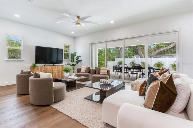 a white tub sitting next to a white wall
