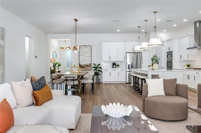 a en suite bathroom with a double vanity sink and mirror