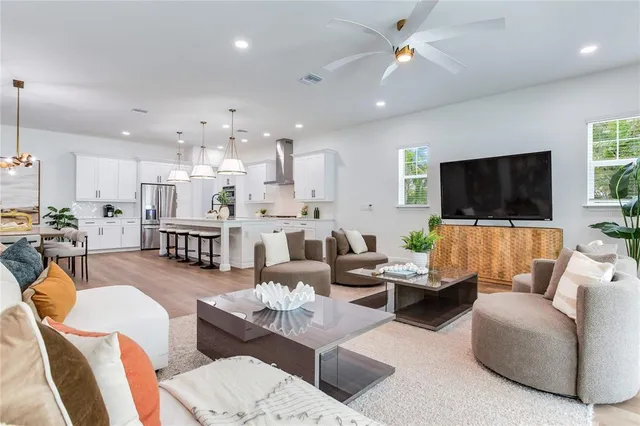 a view of a kitchen with stairs and an entryway