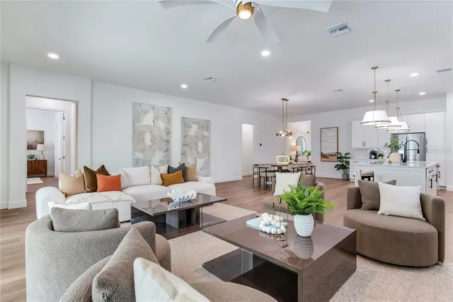 a view of a hallway with wooden floor and closet