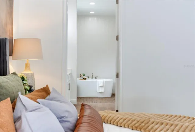 a bathroom with a shower a sink and a toilet