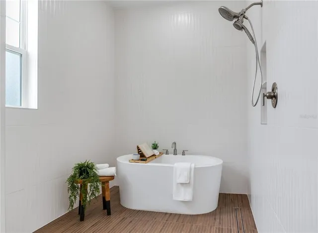 a view of a kitchen with cabinets and a wooden floor