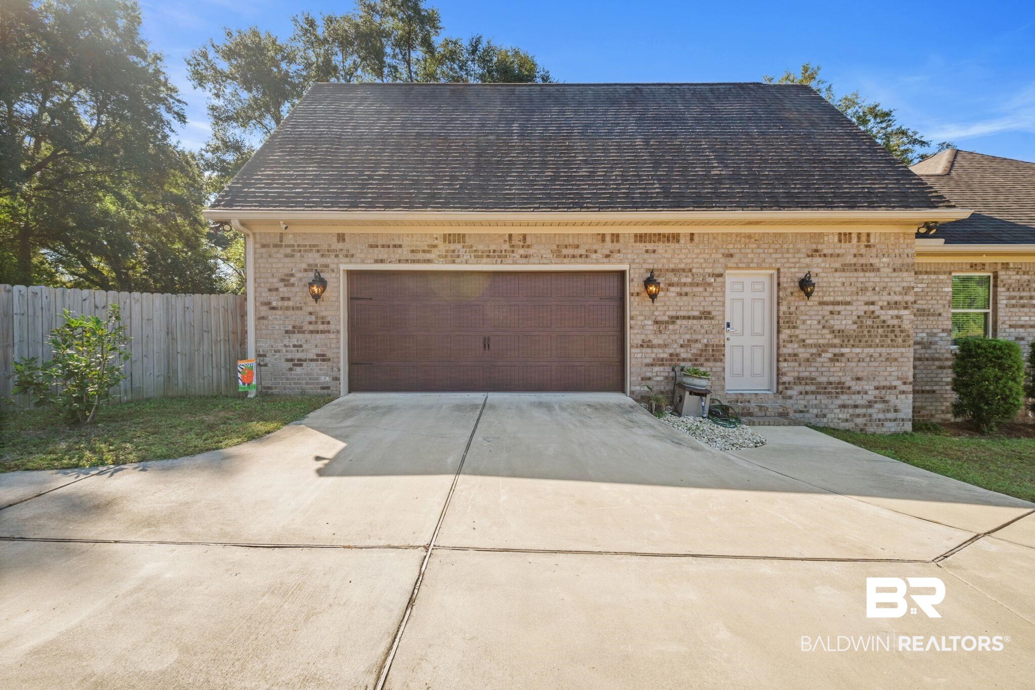 4331 Hamilton Oaks Lane Mobile, AL 36695 - Photo 31 of 38 Garage with concrete driveway and fence