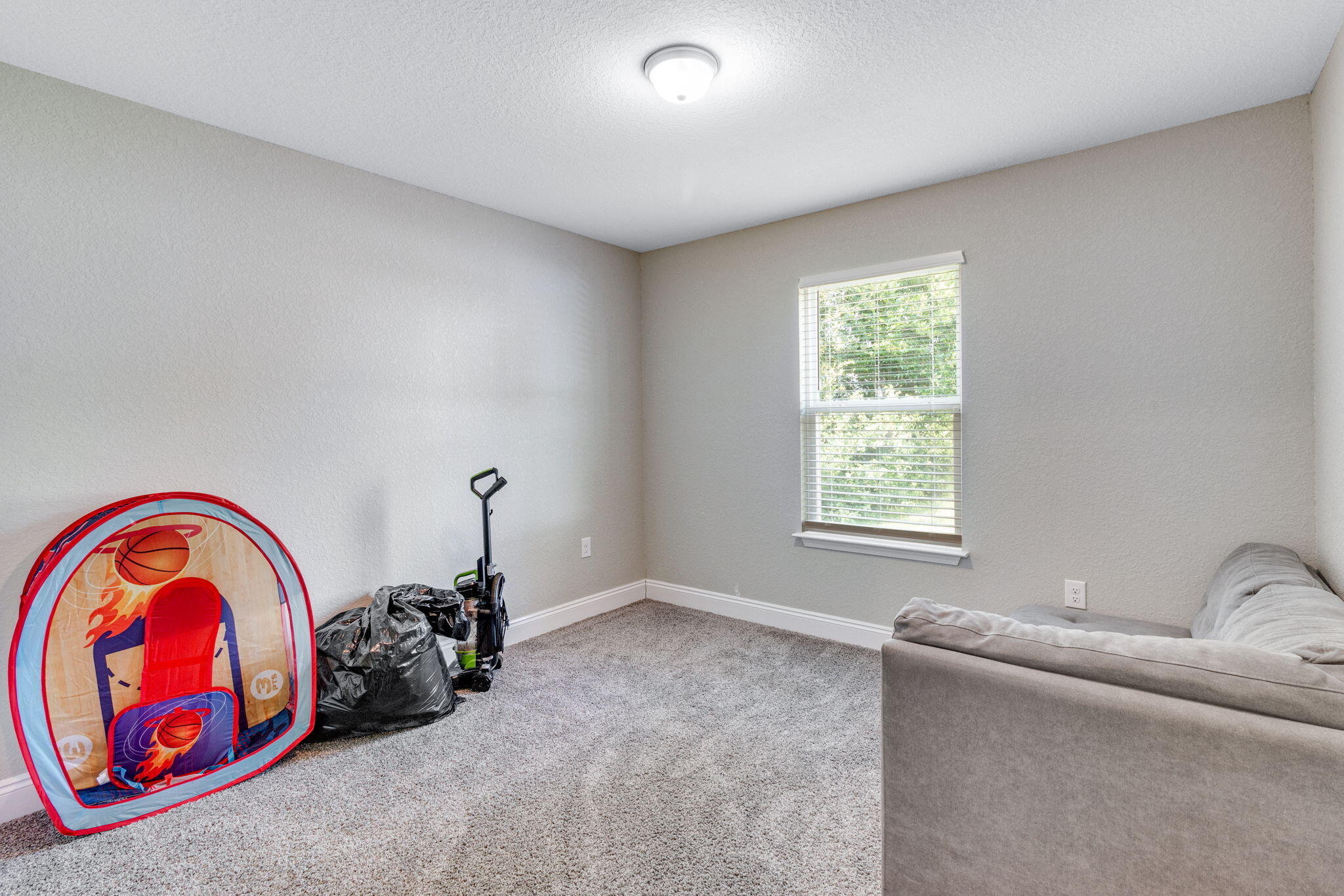 107 Eastview Drive Crestview, FL 32536 - Photo 20 of 23 a bedroom with a bed and a window