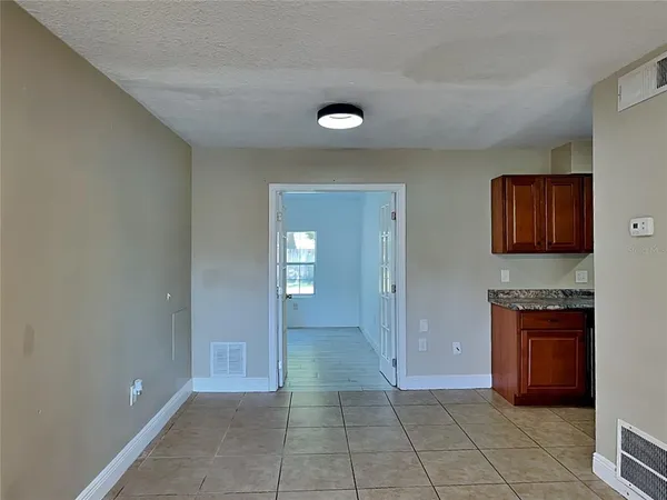 a view of a kitchen cabinets and a room