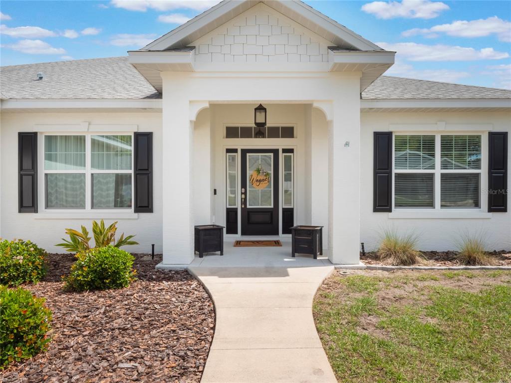 4735 Northwest 11th Court Ocala, FL 34475 - Photo 2 of 34 a front view of a house with a yard