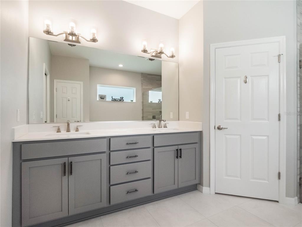 4735 Northwest 11th Court Ocala, FL 34475 - Photo 22 of 34 a bathroom with a granite countertop sink double and mirror