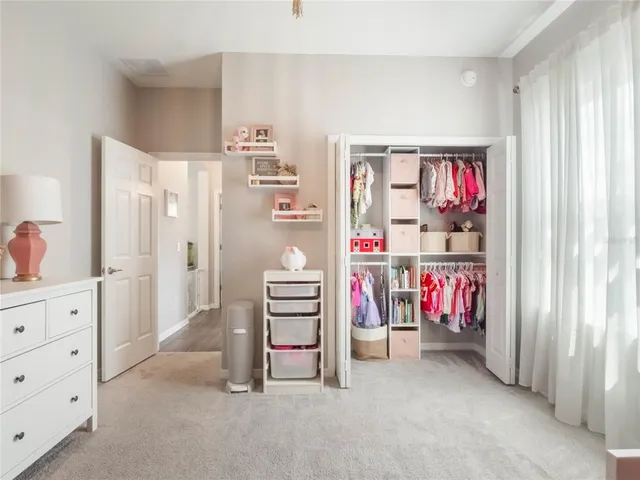 a view of a kitchen with sink and cabinets