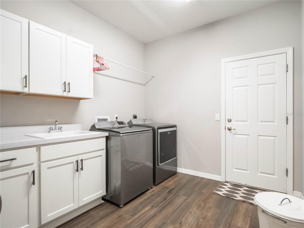 4735 Northwest 11th Court Ocala, FL 34475 - Photo 29 of 34 a view of a kitchen with sink and cabinets
