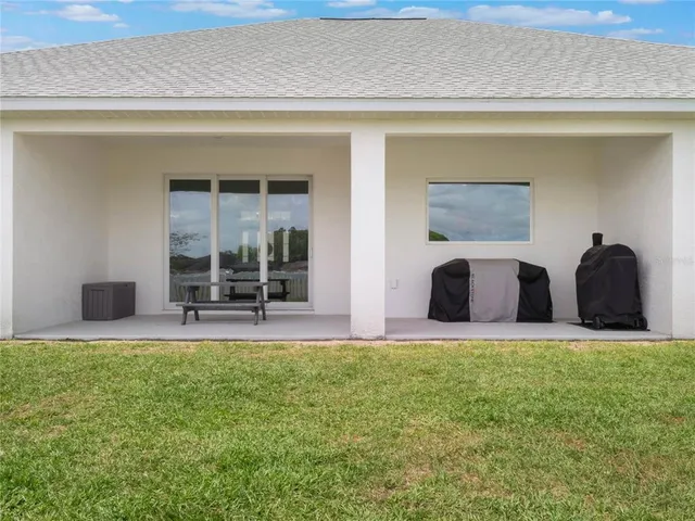 a view of a house with a big yard