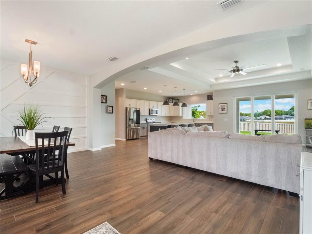 4735 Northwest 11th Court Ocala, FL 34475 - Photo 5 of 34 a living room with furniture and a wooden floor
