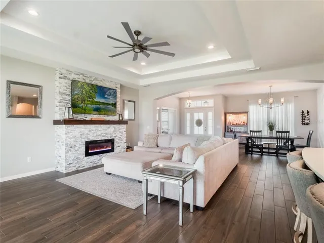 a living room with furniture fireplace and a flat screen tv
