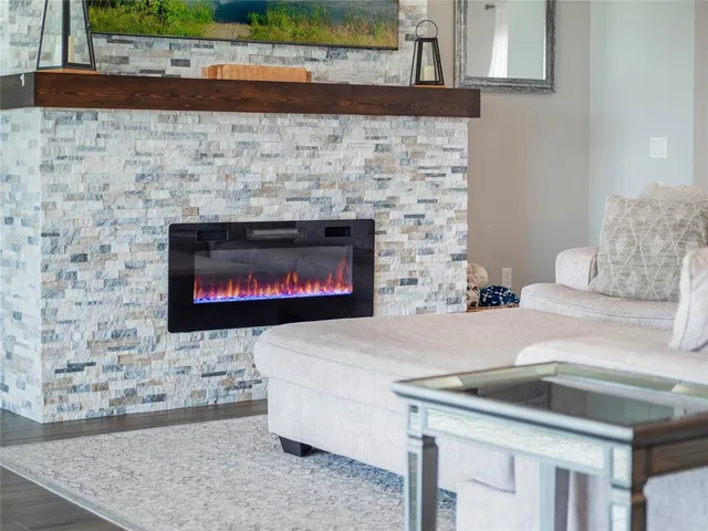 a kitchen with a stove and a fireplace