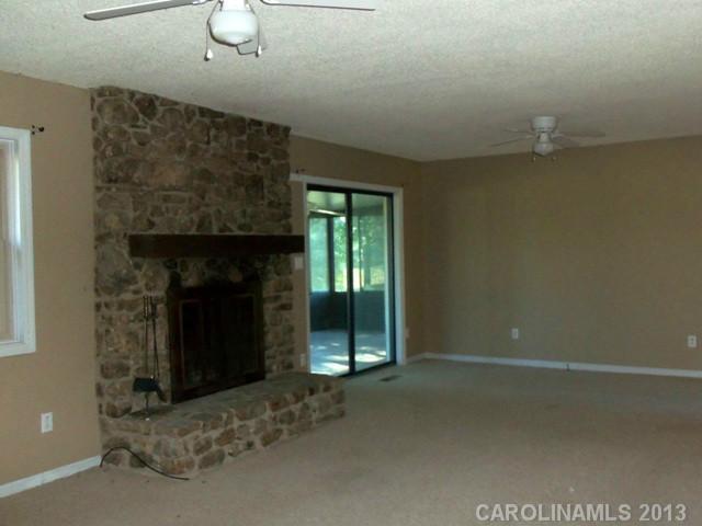 2949 Cat Square Road Vale, NC 28168 - Photo 3 of 10 a living room with a fireplace