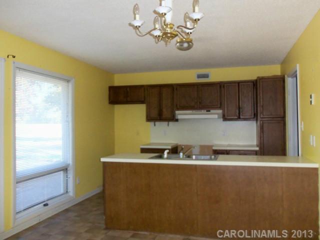 2949 Cat Square Road Vale, NC 28168 - Photo 6 of 10 a kitchen with a sink a stove and cabinets