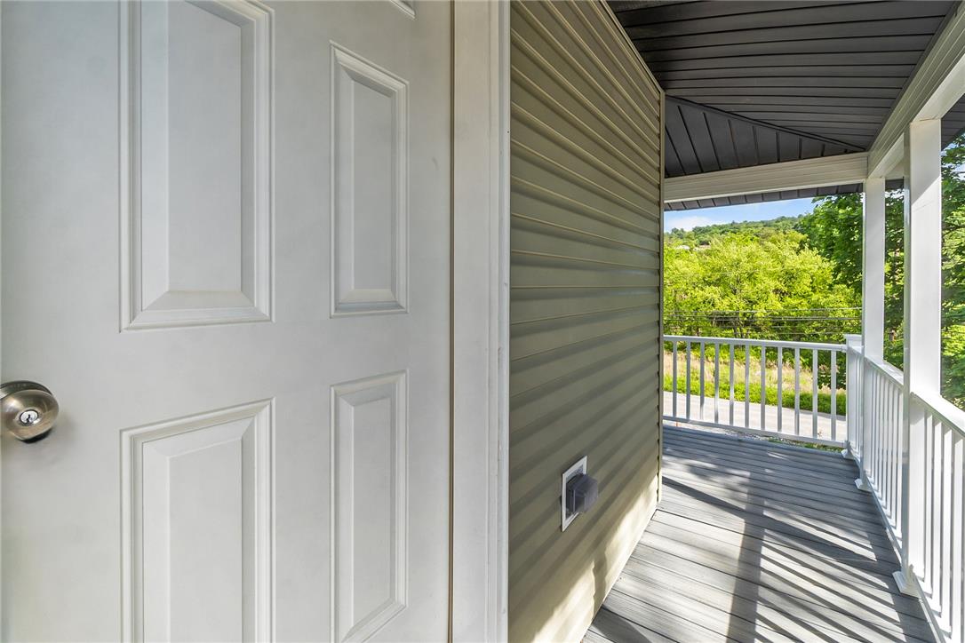 624 Main Road Lehighton, PA 18235 - Photo 12 of 42 A welcoming front entry opens to a private balcony with verdant views.