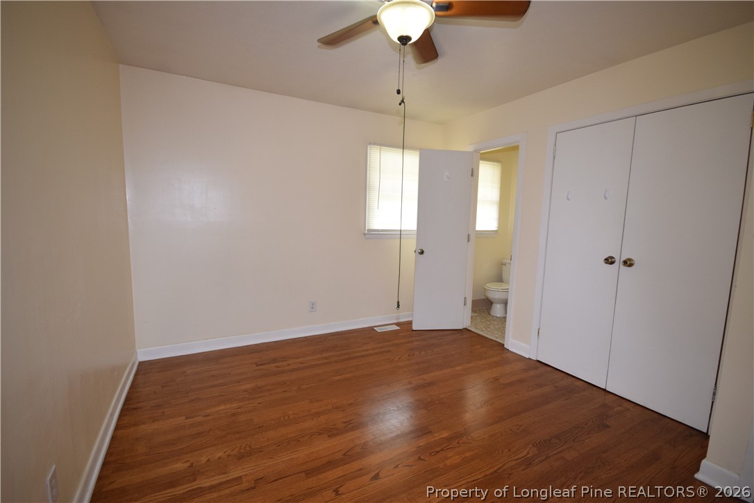 108 South 6th Street Spring Lake, NC 28390 - Photo 5 of 20 wooden floor in an empty room with a window