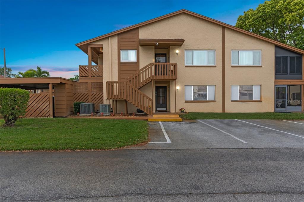 4445 Pelorus Drive New Port Richey, FL 34652 - Photo 23 of 26 a front view of a house with a yard