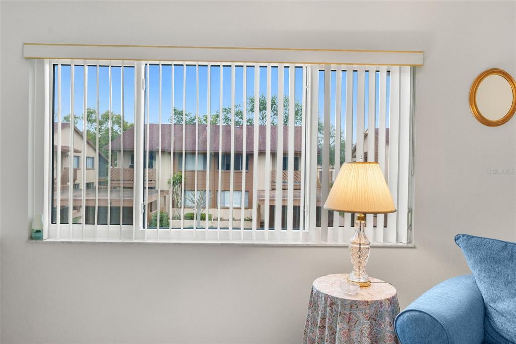 4445 Pelorus Drive New Port Richey, FL 34652 - Photo 7 of 26 a table and chair in a room with window