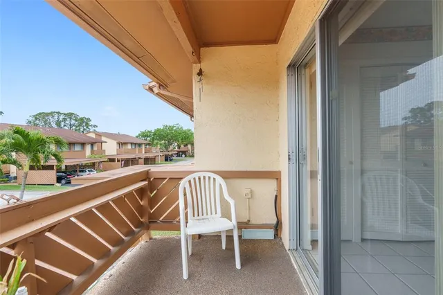 a view of balcony with furniture