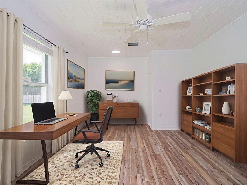6445 55th Square Vero Beach, FL 32967 - Photo 22 of 36 a workspace with furniture window and wooden floor