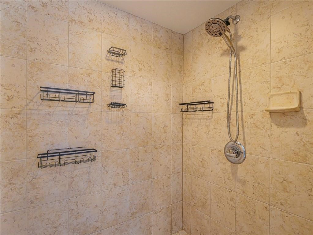6445 55th Square Vero Beach, FL 32967 - Photo 26 of 36 a bathroom with a shower